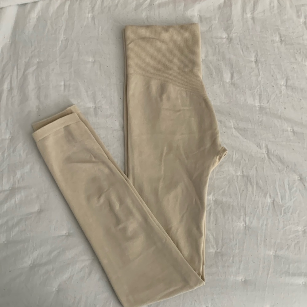 Beige colored leggings.